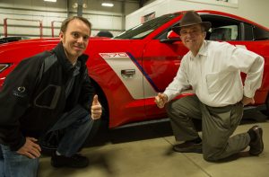 Jack Roush Sr. and Jack Roush Jr. pose with the Race Red 2016 ROUSH Warrior Mustang!