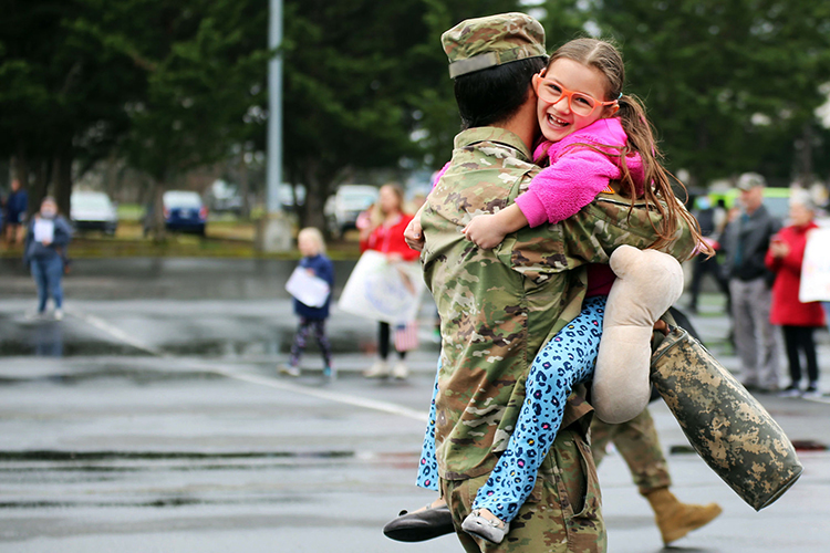 Dad reunites with daughter after deployment 